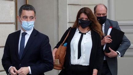 Gérald Darmanin, Marlène Schiappa et&nbsp;Eric Dupond-Moretti au palais de l'Elysée, le 9 décembre 2020 à Paris. (CHARLES PLATIAU / AFP)