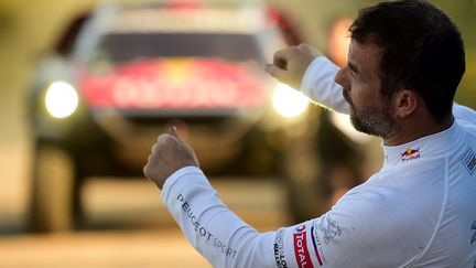 Pour son premier Dakar en carrière, Sébastien Loeb (Peugeot), nonuple champion du monde en Rallye WRC, a vécu deux Dakar différents : une première semaine exceptionnelle et une seconde ensablée...  (FRANCK FIFE / AFP)