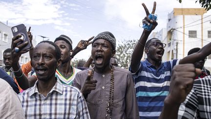 Protesters during a march calling on authorities to respect the election date, in Dakar (Senegal), February 16, 2024. (JOHN WESSELS / AFP)