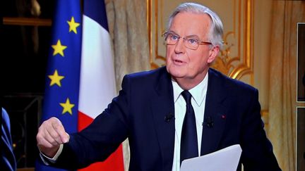 Le Premier minsitre Michel Barnier invité des journaux télévisés de TF1 et de France 2, mardi 3 décembre 2024. (ALEXANDRE MARCHI / MAXPPP)