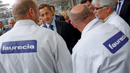 La visite de Nicolas Sarkozy à l'usine Faurecia de Caligny le 3 septembre (© AFP/CHRISTOPHE ENA)