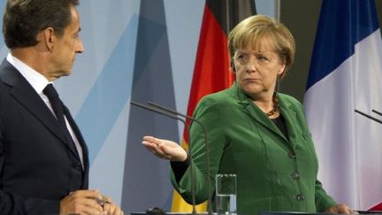 Nicolas Sarkozy et Angela Merkel (octobre 2011) (ODD ANDERSEN / AFP)