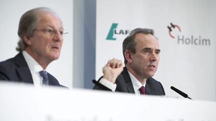 &nbsp; (Wolfgang Reitzle (Holcim) et Eric Olsen (Lafarge) lors de la conférence de presse à Zurich annonçant la fusion des 2 groupes, le 9 avril 2015 © Maxppp)