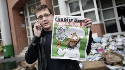 Le directeur de la publication de Charlie Hebdo, le dessinateur Charb,  a immédiatement lié l'incendie au piratage présumé du numéro spécial de mercredi destiné à "fêter la victoire" du parti islamiste Ennahda en Tunisie. (AFP / ALEXANDER KLEIN)