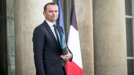 Olivier Dussopt, ministre du Travail, sur les marches du palais de l'Elysée, à Paris, le 12 octobre 2022. (ARTHUR NICHOLAS ORCHARD / HANS LUCAS / AFP)