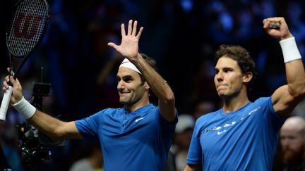 Roger Federer et Rafael Nadal se sont imposés en simple et en double ce samedi (MICHAL CIZEK / AFP)