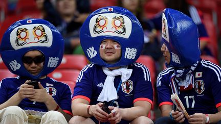 Des supporters nippons avant le match entre la C&ocirc;te d'Ivoire et le Japon, samedi 14 juin &agrave; Recife (Br&eacute;sil). (TOSHIFUMI KITAMURA / AFP)