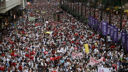 Des centaines de milliers de personnes ont manifesté dans les rues de Hong Kong, le 9 juin 2019.&nbsp; (DALE DE LA REY / AFP)