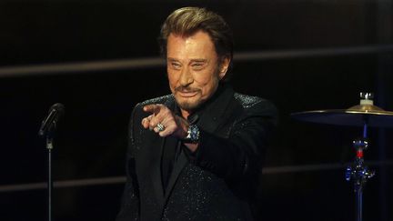 Johnny Hallyday sur le plateau du T&eacute;l&eacute;thon, sur France 2, le 6 d&eacute;cembre 2014, &agrave; Paris. (FRANCOIS GUILLOT / AFP)