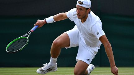 Lucas Pouille à terre  (LEON NEAL / AFP)