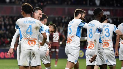 Les Marseillais célèbrent le but décisif d'Arkadiusz Milik contre Metz, le 13 février 2022 lors de la 24e journée de Ligue 1. (JEAN-CHRISTOPHE VERHAEGEN / AFP)