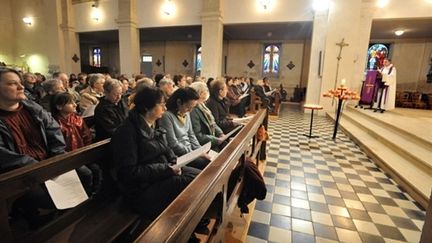 Hommage aux victimes de la tempête Xynthia, à l'église de l'Aiguillon-sur-Mer (3 mars 2010) (AFP / Frank Perry)