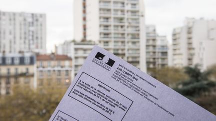 La suppression intégrale de la taxe d'habitation pour les 20% de ménages les plus aisés interviendra en 2023, et non en 2022 comme annoncé jusqu'à présent. (RICCARDO MILANI / HANS LUCAS / AFP)