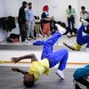 Le b-boy Dany Dann s'entraîne devant les autres athlètes du groupe France de l'Insep, le 28 septembre 2022. (ANNE-CHRISTINE POUJOULAT / AFP)