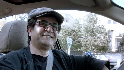 Le réalisateur iranien dissident Jafar Panahi, ici dans son film "Taxi Teheran" (2015).
 (Jafar Panahi Film Productions / Archives du 7eme Art / Photo12)