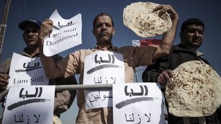 Manifestants bahreïnis à Isa, au sud de la capitale Manama, le 5 Février 2013. «Nous sommes toujours rejetés», disent-ils. Ces chiites ont été licenciés parce qu'ils ont participé à des manifestations anti-régime. (AFP PHOTO / MOHAMMED AL-SHAIKH)