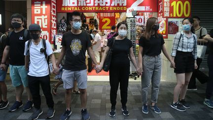 Malgré l'interdiction, des manifestants défilent les autorités et portent à masque à Hong Kong (Chine), le 5 octobre 2019. (KOKI KATAOKA / YOMIURI)