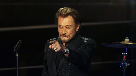 Johnny Halliday lors du 28e T&eacute;l&eacute;thon, le 6 d&eacute;cembre 2014 &agrave; Paris. (FRANCOIS GUILLOT / AFP)