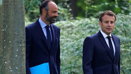 Édouard Philippe (G) et Emmanuel Macron (D), le 29 juin 2020. (CHRISTIAN HARTMANN / POOL / AFP)