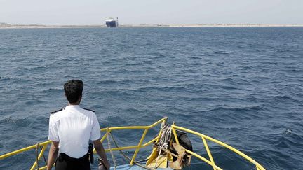 A cargo ship, seized by the Houthis from an Israeli businessman on November 19, 2023, is anchored off the Red Sea coast of Al-Hudaydah (Yemen) on May 12, 2024. (MOHAMMED HAMOUD / ANADOLU / AFP)