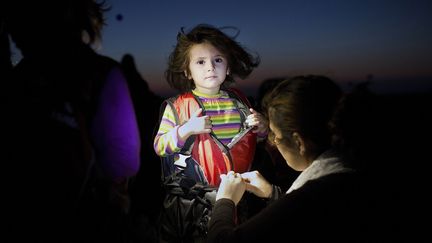 Elle vient d'arrive sur l'île grecque après une traversée depuis la Turquie.
 (Angelos Tzortzinis / AFP)