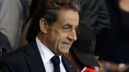 L'ancien pr&eacute;sident de la R&eacute;publique Nicolas Sarkozy assiste au match PSG-Lyon, le 21 septembre 2014, au Parc des princes, &agrave; Paris. (KENZO TRIBOUILLARD / AFP)