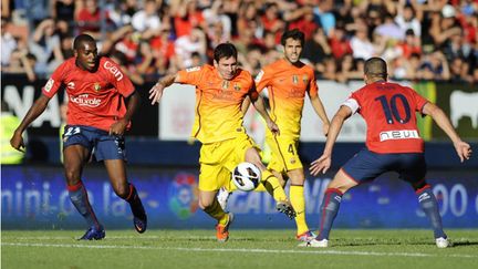 La grande complicité de Messi et Villa sous le maillot de Barcelone (RAFA RIVAS / AFP)