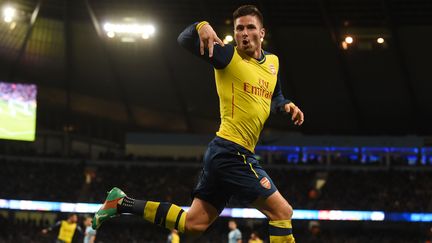 Olivier Giroud jubile et les Gunners surprennent City (PAUL ELLIS / AFP)