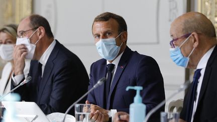 Jean Castex et Emmanuel Macron, en août 2020. (KAMIL ZIHNIOGLU / POOL)