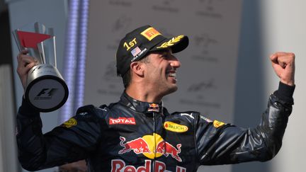 Daniel Ricciardo (Red Bull) laisse éclater sa joie après sa victoire à Sépang en Malaisie (MOHD RASFAN / AFP)