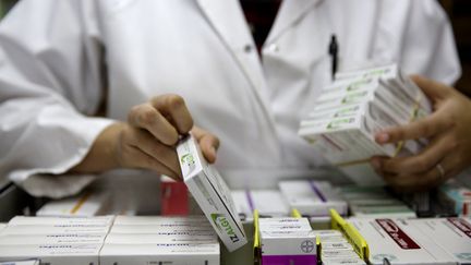 A community pharmacist (photo illustration).  (FLORIAN DAVID / AFP)