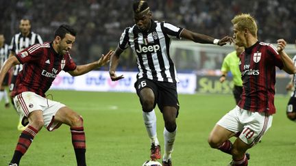 Pogba face à Rami (OLIVIER MORIN / AFP)