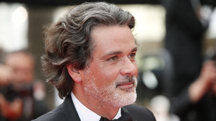 Christophe Barratier, producteur et réalisateur au Festival de Cannes, le 21 mai 2014. (VALERY HACHE / AFP)