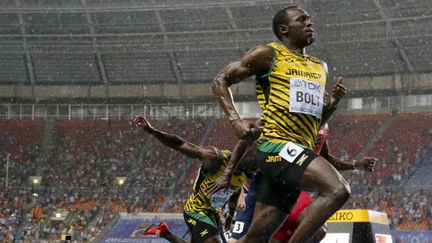 Le sprinter jama&iuml;cain Usain Bolt lors de sa victoire dans l'&eacute;preuve du 100 m des Mondiaux de Moscou, le 11 ao&ucirc;t 2013.&nbsp; (LUCY NICHOLSON / REUTERS)