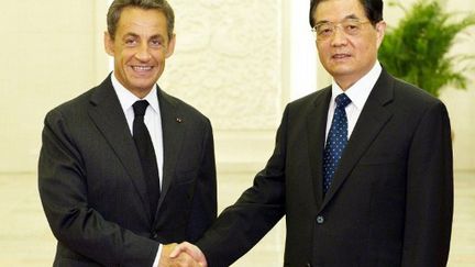 Nicolas Sarkozy et le président chinois Hu Jintao (23 août 2011) (AFP/Li Xueren / XINHUA)