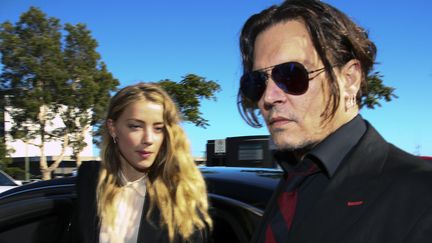 Amber Heard et Johnny Deep, en avril 2016, à leur arrivée au tribunal australien
 (Patrick HAMILTON / AFP)