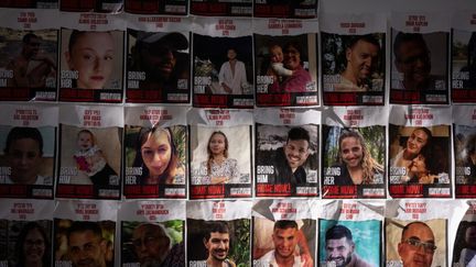 Posters on a wall in Tel Aviv representing Israeli hostages held by Hamas, November 21, 2023. (RAPHAEL GOTHEIL / HANS LUCAS)