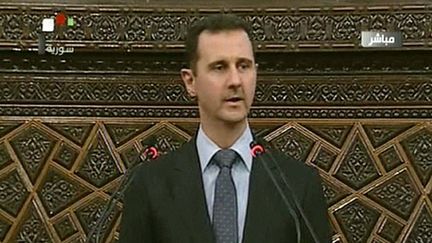 Le pr&eacute;sident syrien Bachar Al-Assad film&eacute; par la t&eacute;l&eacute;vision d'Etat syrienne lors de son discours devant le Parlement syrien &agrave; Damas (Syrie) le 3 juin 2012.&nbsp; (AFP / SYRIAN TV)