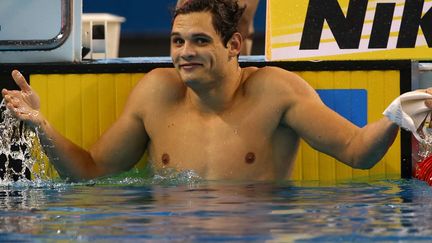 Le Fran&ccedil;ais Florent Manaudou r&eacute;agit apr&egrave;s avoir remport&eacute; son second titre de champion du monde lors des championnats de natation &agrave; Doha (Qatar), le 6 d&eacute;cembre 2014. (MARWAN NAAMANI / AFP)