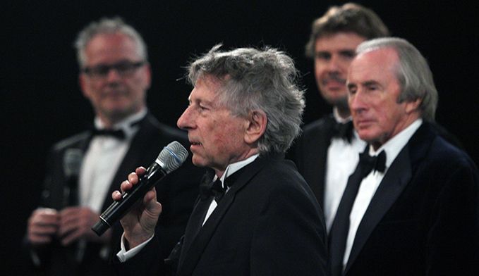 Roman Polanski lors de la présentation du film à Cannes, devant Jackie Stewart, Mark Stewart, fils de Jackie et coproducteur du film, et Thierry Frémaux, le délégué général du Festival de Cannes
