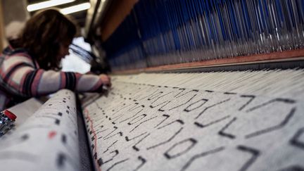 Travail sur une des machines dans l'usine Arpin, novembre 2017
 (JEFF PACHOUD / AFP)