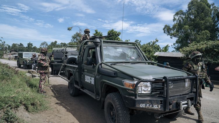 Soldiers from the East African Community Regional Force (EACRF) accompany journalists in areas controlled by the March 23 Movement (M23) in Bunagana, Democratic Republic of Congo (DRC), April 19 2023. (GLODY MURHABAZI / AFP)