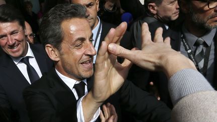 L'ancien pr&eacute;sident de la R&eacute;publique Nicolas Sarkozy lors de son arriv&eacute;e &agrave; l'Institut Claude-Pompidou, le 10 mars 2014 &agrave; Nice (Alpes-Maritimes). (VALERY HACHE / AFP)