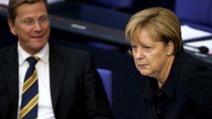 La chancelière allemande, Angela Merkel, et le ministre des Affaires étrangères, Guido Westerwelle (AFP - ODD ANDERSEN)