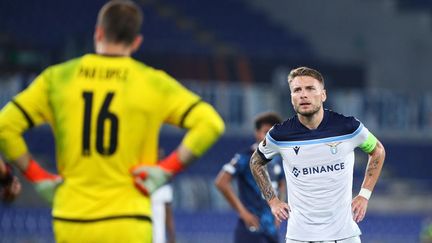 Pau Lopez face à Ciro Immobile, sur la pelouse du Stadio Olimpico, le 21 octobre 2021. (FEDERICO PROIETTI / FEDERICO PROIETTI)