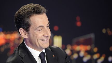 Le pr&eacute;sident Nicolas Sarkozy lors de l'officialisation de sa candidature &agrave; l'&eacute;lection pr&eacute;sidentielle, le 15 f&eacute;vrier 2012, sur le plateau de TF1.&nbsp; (LIONEL BONAVENTURE / POOL)