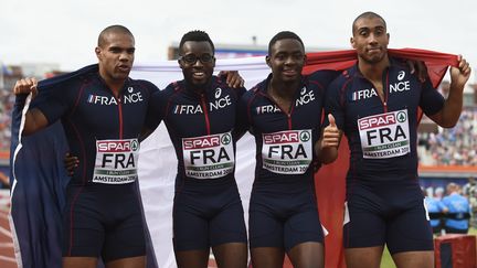 Les relayeurs français Marvin René, Stuart Dutamby, Mickael Zeze et Jimmy Vicaut,&nbsp;le 10 juillet 2016 à Amsterdam (Pays-Bas). (JOHN THYS / AFP)