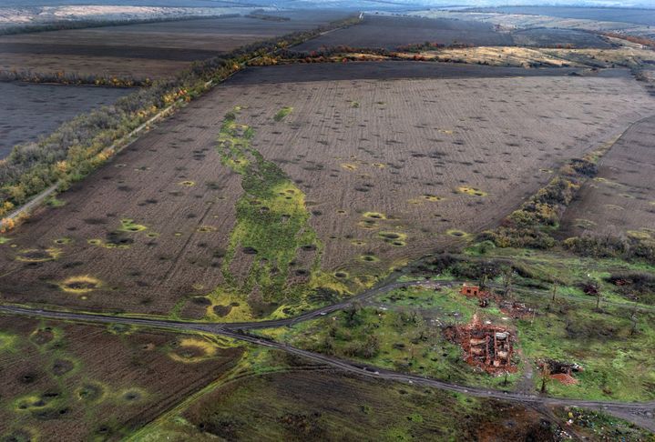 Aerial view of a field dotted with artillery craters, October 24, 2022 in Sulyhivka, in the Kharkiv region.  (CARL COURT / GETTY IMAGES EUROPE)