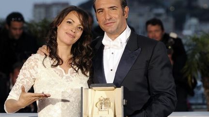 Prix d&#039;interprétation maculine pour &quot;The Artist&quot;, une Palme d&#039;or inaugurale de biens d&#039;autres récompenses, pour Jean Dujardin, au côté de Berenice Bejo, sa partenaire du film.
 (ANNE-CHRISTINE POUJOULAT/AFP)