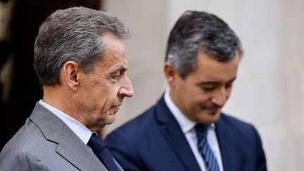 Nicolas Sarkozy et Gérald Darmanin, le 19 octobre 2022 à Paris. (LUDOVIC MARIN / AFP)